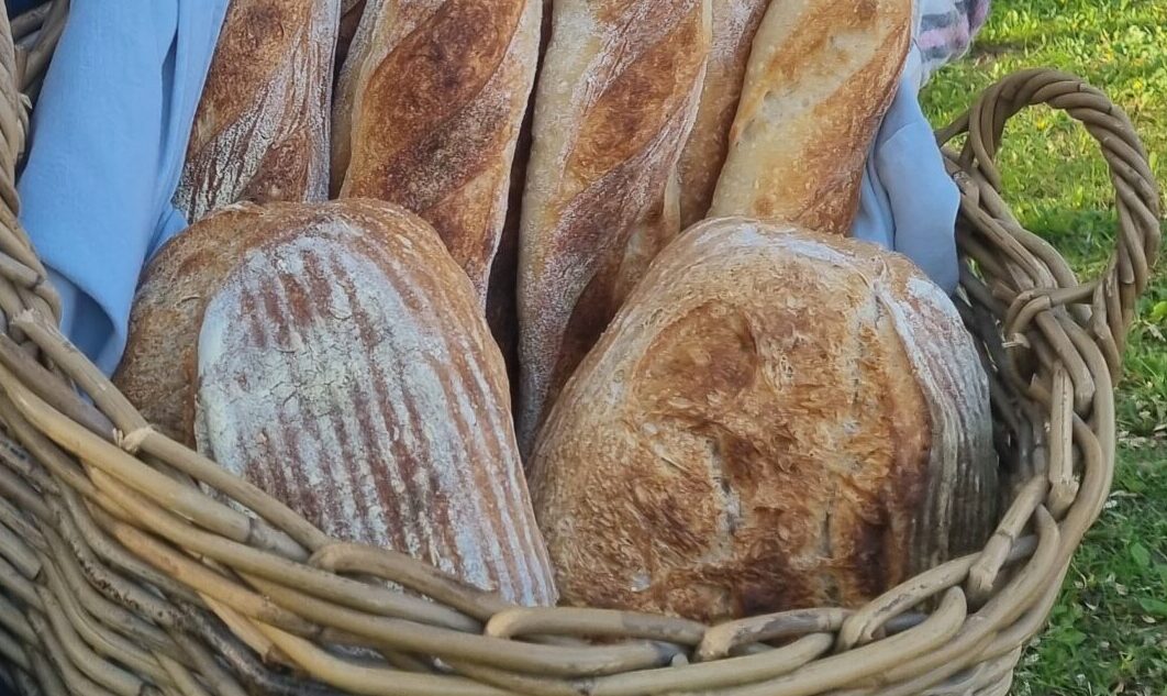 The bread of the Vaiteliški bakers is scooped out with a tongs